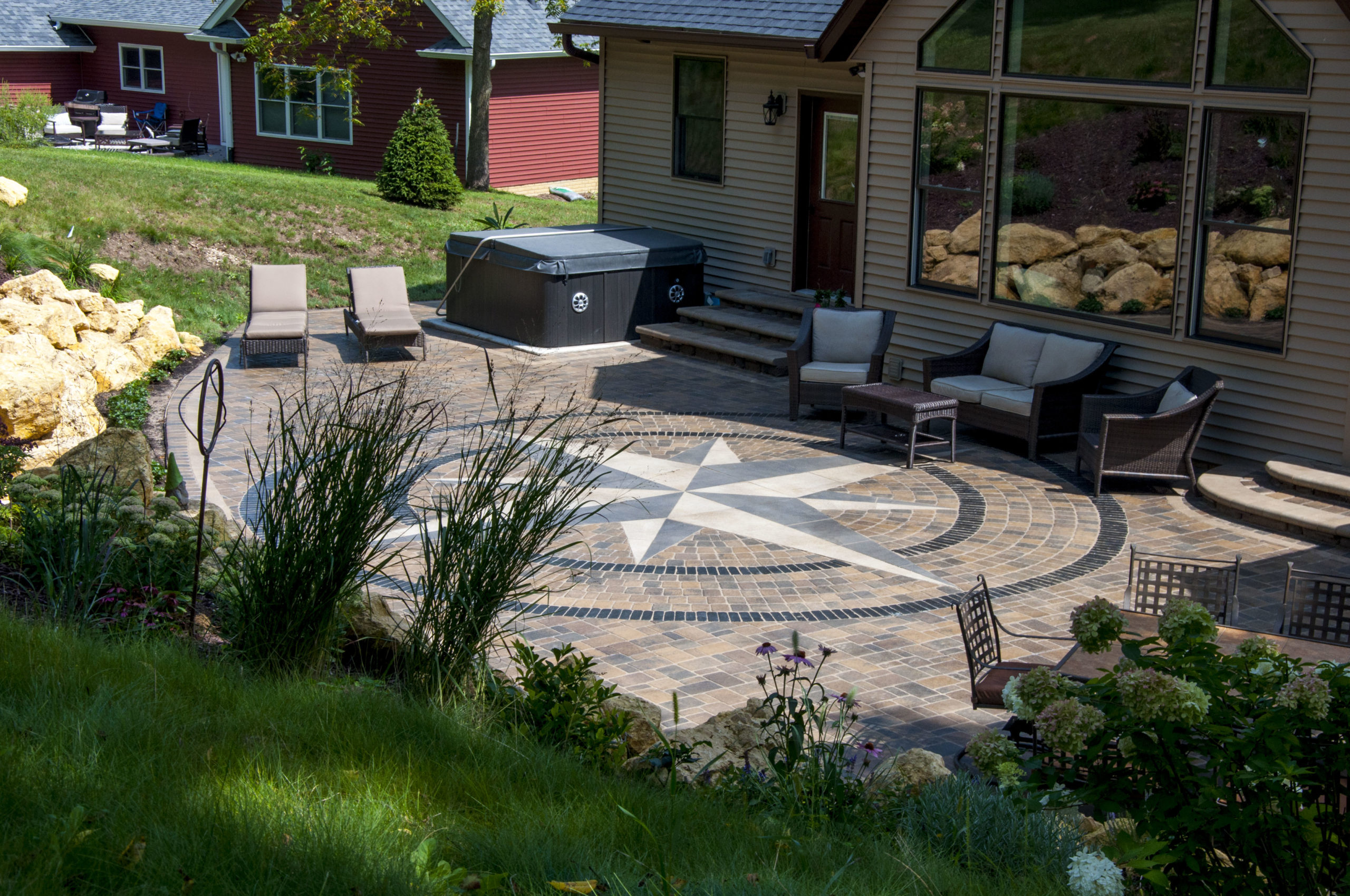 unique paver patio with retaining wall and steps