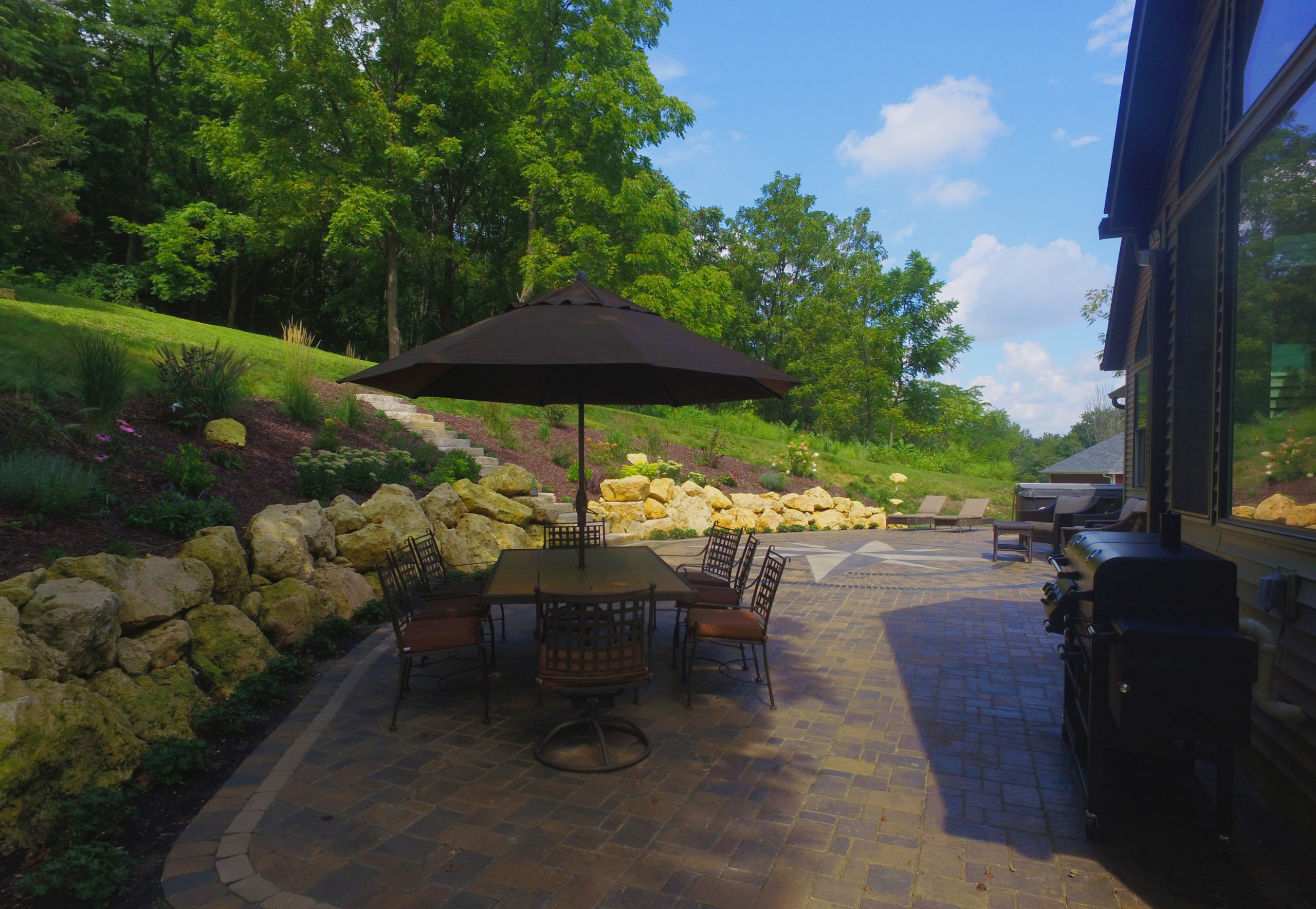 residential unique paver patio and retaining wall